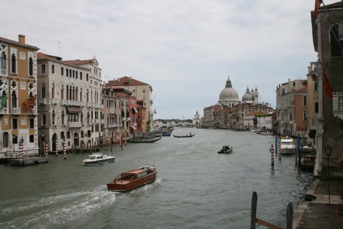 Boats on the Grand Canal in Venice, with Santa Maria della Salute's dome beyond.
