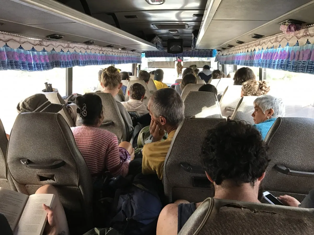 Packed bus aisle full of travelers on the ride from the 4000 Islands to Pakse.