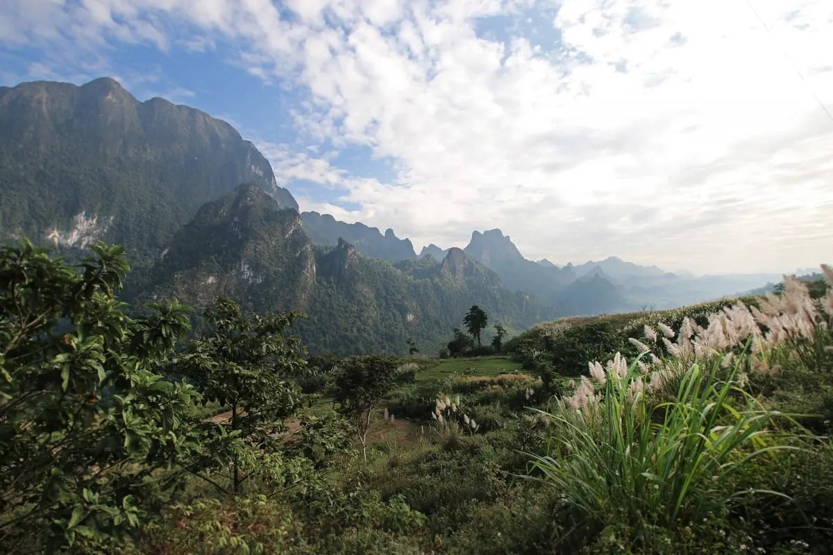 Green karst mountain valley on the drive from Luang Prabang to Vientiane.