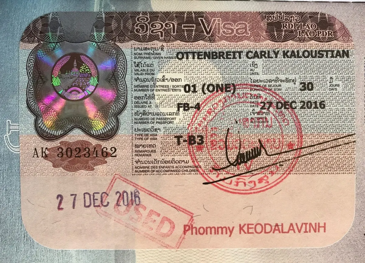 Thirty-day Lao visa on arrival sticker in a passport, stamped December 2016