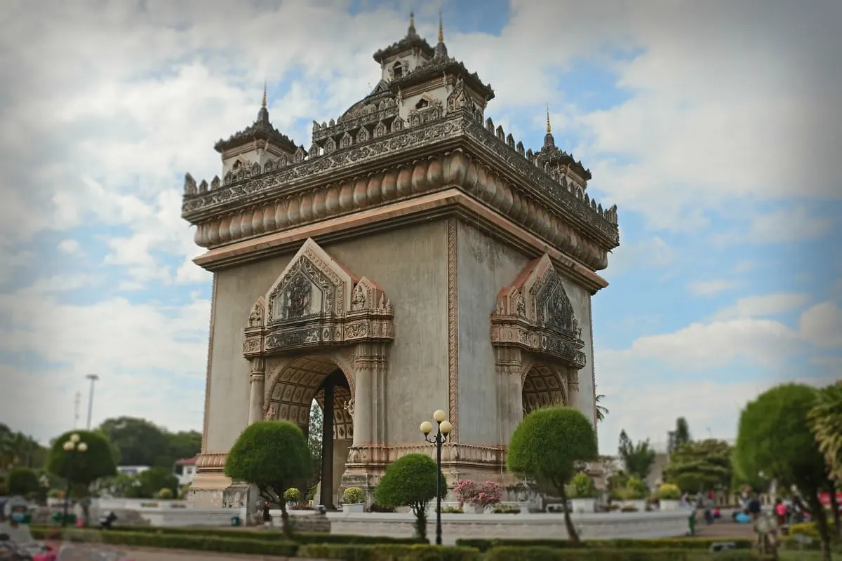Patuxai, the ornate war memorial arch in downtown Vientiane, framed by topiary.
