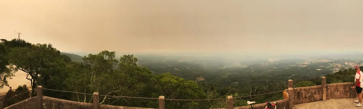 Panorama of forested hills under thick wildfire smoke, June 2017