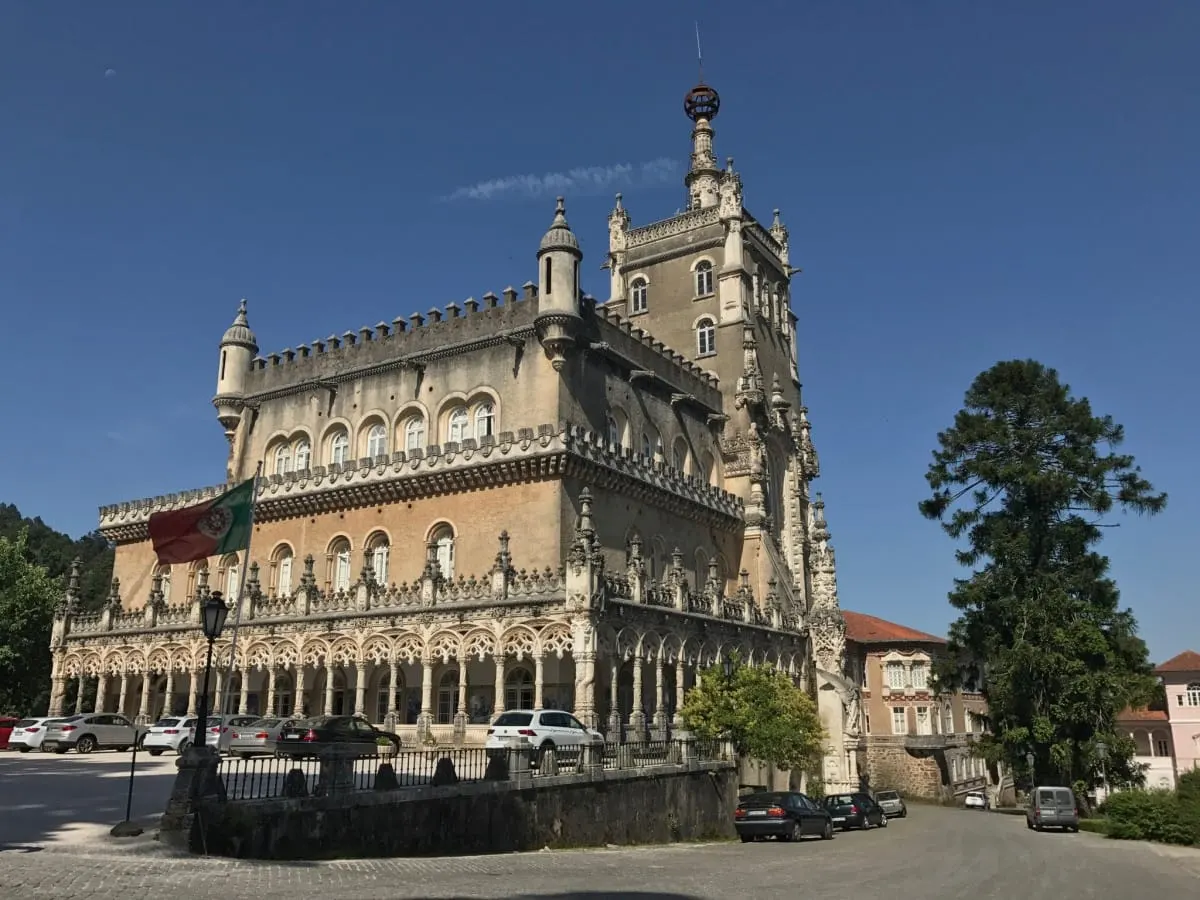 Neo-Manueline facade and tower of the Palacio do Bucaco under blue sky