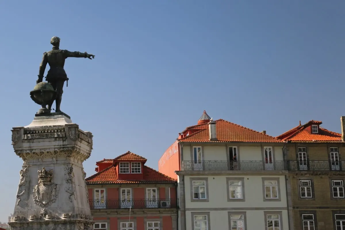Statue of Henry the Navigator pointing over Porto's red-tiled rooftops