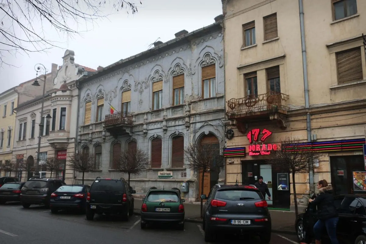 Art nouveau facades and parked cars on an Arad street